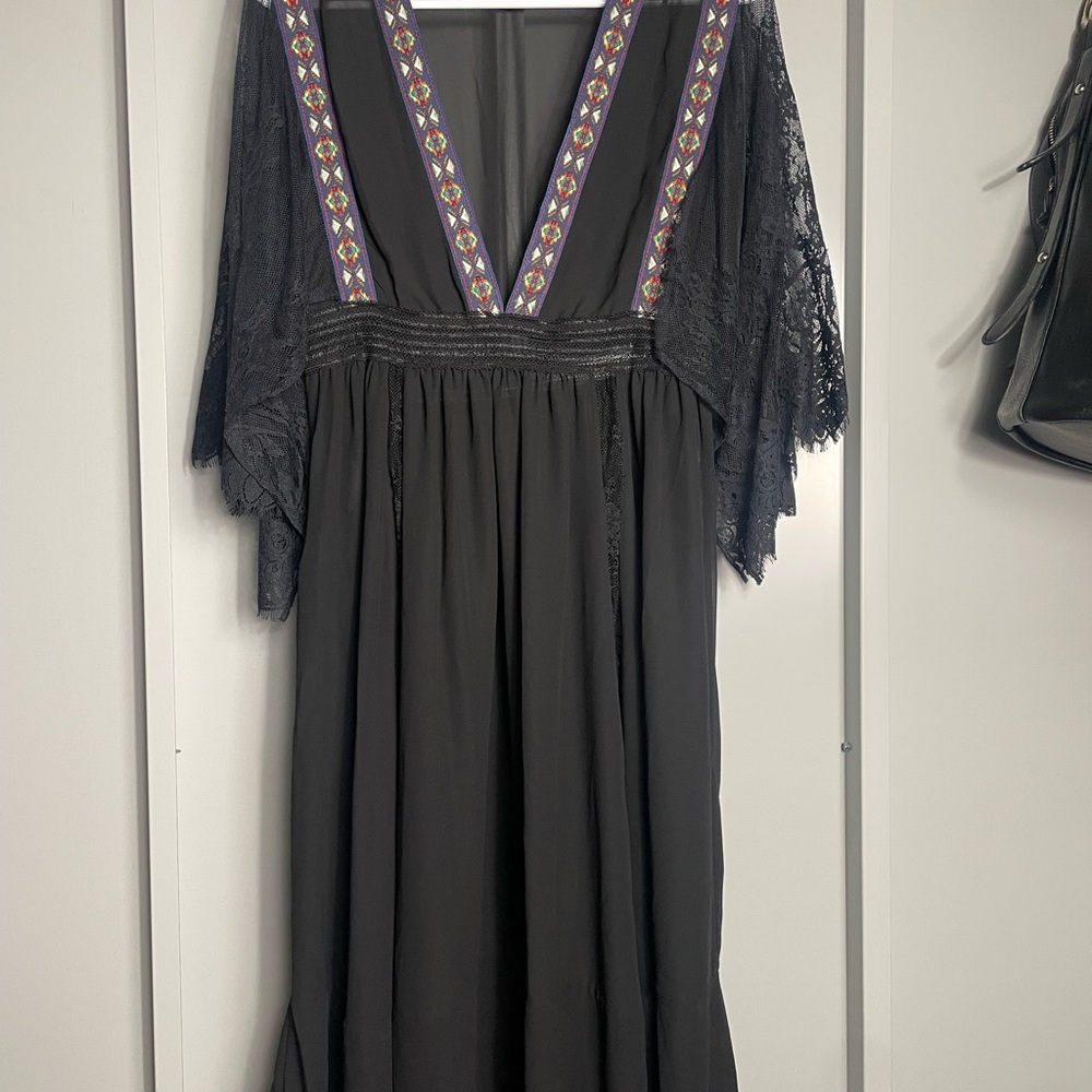 Elegant Black Dress with Lace and Geometric Accents